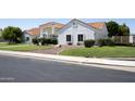 Well-manicured lawn enhances the curb appeal of this delightful single-story home at 3314 E Draper Cir, Mesa, AZ 85213
