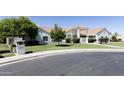 Single-story home featuring a pristine lawn and an attractive entryway at 3314 E Draper Cir, Mesa, AZ 85213