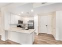 Bright kitchen with stainless appliances, white cabinets, and spacious center island at 5450 E Deer Valley Dr # 1211, Phoenix, AZ 85054
