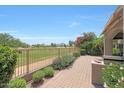 Spacious backyard with lush greenery, paver patio and golf course views at 8541 E Krail St, Scottsdale, AZ 85250