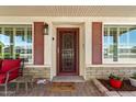 Inviting front porch featuring decorative shutters, a storm door, and a cozy seating area at 9666 W Mountain View Rd # A, Peoria, AZ 85345