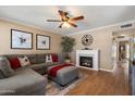 Cozy living room featuring a decorative fireplace, ample seating and neutral wall color at 9666 W Mountain View Rd # A, Peoria, AZ 85345