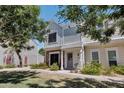 Charming two-story townhome features light-blue wood siding and mature landscaping at 1600 N Saba St # 214, Chandler, AZ 85225