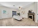 Inviting living room with tiled floors, fireplace, and neutral decor at 1600 N Saba St # 214, Chandler, AZ 85225