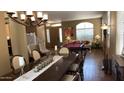 Dining room with a large table, neutral color walls, and natural lighting at 17658 N 52Nd Pl, Scottsdale, AZ 85254