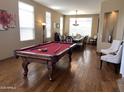 Spacious game room with a pool table and a dining table in the background at 17658 N 52Nd Pl, Scottsdale, AZ 85254