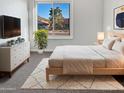 Relaxing bedroom with a comfortable bed, soft carpet, and a window view of the neighborhood at 1901 E Hearn Rd, Phoenix, AZ 85022