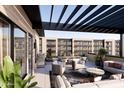 Expansive private balcony with grill, dining and lounge seating, perfect for outdoor entertaining at 19360 N 73Rd St # 1056, Scottsdale, AZ 85255