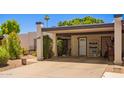 Inviting home with a covered parking spot, desert landscaping, and direct access to the front door at 1951 E Del Sur Dr, Tempe, AZ 85283