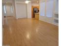 Spacious open-concept living room showcasing wood floors, and great natural light at 1970 W Park Pl, Chandler, AZ 85224