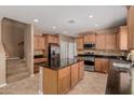 Spacious kitchen featuring granite countertops, stainless steel appliances, and a large center island at 21136 N 36Th Pl, Phoenix, AZ 85050