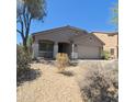 Charming single story home with desert landscaping and a two car garage at 23771 W Yavapai St, Buckeye, AZ 85326