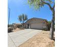 Charming single story home with desert landscaping and a two car garage at 23771 W Yavapai St, Buckeye, AZ 85326