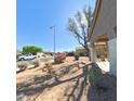 Well maintained front yard with desert landscaping and flowers at 23771 W Yavapai St, Buckeye, AZ 85326
