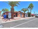 Charming single-story home featuring desert landscaping, palm trees, and street parking at 245 S 56Th St # 137, Mesa, AZ 85202
