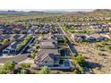 This aerial view showcases the home's location and backyard oasis, complete with a sparkling pool and desert landscaping at 25155 N 108Th Ave, Peoria, AZ 85383