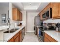 Well-lit kitchen with stainless steel appliances and stylish countertops, offering a modern cooking space at 3830 E Lakewood E Pkwy # 3014, Phoenix, AZ 85048