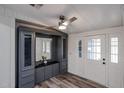 Inviting entryway with a built-in storage unit, a ceiling fan, and french doors at 4065 E University Dr # 436, Mesa, AZ 85205