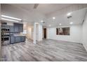 Spacious living room with ample natural light, neutral walls, and wood-look flooring at 4065 E University Dr # 436, Mesa, AZ 85205