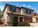 Two-story home with desert landscaping, a two-car garage, and a paver driveway at 10830 W El Cortez Pl, Peoria, AZ 85383