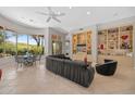 Bright living area features built-in shelving, tile floors, and large windows with views at 11081 E Betony Dr, Scottsdale, AZ 85255