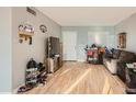 Bright and airy living room with hardwood floors, a large window, and neutral paint at 13802 N 37Th Dr, Phoenix, AZ 85053