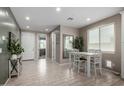 Bright dining area with a modern table set and a view of the backyard at 20926 E Longwood Dr, Queen Creek, AZ 85142