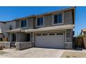Exterior view of a two-story home featuring a two-car garage at 20926 E Longwood Dr, Queen Creek, AZ 85142