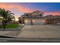 This beautiful two-story home features a spacious three-car garage at 25818 N 68Th Ave, Peoria, AZ 85383
