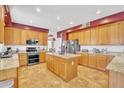 Spacious kitchen featuring stainless steel appliances, granite countertops, a center island, and ample cabinet space for storage at 2642 S Joplin --, Mesa, AZ 85209