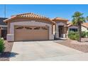 Single story home featuring a desert landscaped front yard and a large two car garage at 3133 E Redwood Ct, Phoenix, AZ 85048