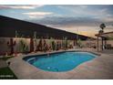 Relaxing backyard pool featuring desert landscaping and plenty of room to relax and entertain at 3133 E Redwood Ct, Phoenix, AZ 85048