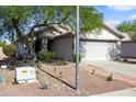 Well-maintained house boasts desert landscaping, two car garage, and a charming covered front entrance at 3534 N 106Th Ln, Avondale, AZ 85392