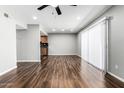 Open concept room with hardwood floors, ceiling fan and bright natural light at 3810 N Maryvale Pkwy # 2020, Phoenix, AZ 85031