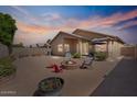 Spacious backyard features a cozy fire pit area, perfect for entertaining guests and enjoying outdoor living at 4459 E Desert Wind Dr, Phoenix, AZ 85044