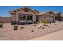 Charming single-story home with desert landscaping featuring cacti, rocks, and drought-tolerant plants at 509 W Villa Rita Dr, Phoenix, AZ 85023