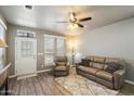 Comfortable living area with tile floors, ceiling fan, and neutral decor at 650 N Hawes Rd # 3424, Mesa, AZ 85207
