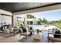 Spacious covered patio with comfortable seating, perfect for outdoor entertaining and relaxation at 6702 E Cholla St, Scottsdale, AZ 85254