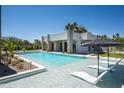 Luxury backyard features a sleek pool with built in loungers and landscaped accents at 6702 E Cholla St, Scottsdale, AZ 85254