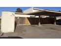 Carport with a car in the parking stall and shed nearby offering parking and some extra storage at 8063 N 31St Ln, Phoenix, AZ 85051
