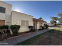 Welcoming front of home featuring desert landscaping and a covered entryway, creating a warm curb appeal at 8063 N 31St Ln, Phoenix, AZ 85051