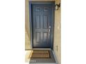 An elegant front door, trimmed in blue, with a 'Welcome Home' doormat at 10850 W Avenida Del Rey --, Peoria, AZ 85383