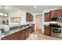 Well-lit kitchen featuring stainless steel appliances, granite countertops, and ample cabinet space at 10850 W Avenida Del Rey --, Peoria, AZ 85383