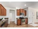 A kitchen featuring stainless steel appliances and brown cabinetry at 10850 W Avenida Del Rey --, Peoria, AZ 85383