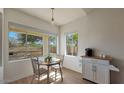 Cozy breakfast nook featuring a small table, chairs, and a large window with scenic views at 1213 W Beck Ln, Phoenix, AZ 85023