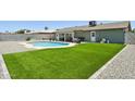 Spacious backyard featuring a well-maintained lawn, a pool area and space for gardening and outdoor activities at 13842 N 40Th Ave, Phoenix, AZ 85053