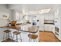Bright kitchen with modern appliances, white cabinetry, and a convenient breakfast bar at 13842 N 40Th Ave, Phoenix, AZ 85053