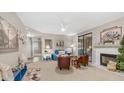Bright living room with fireplace, blue sofa, and stylish decor at 15252 N 100Th St # 1164, Scottsdale, AZ 85260
