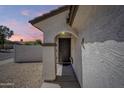 Inviting entryway with decorative door and well-maintained stucco exterior at 16523 W Desert Bloom St, Goodyear, AZ 85338