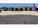 Charming ranch style home featuring an extended driveway and desert landscaping at 18045 N 20Th N Ln, Phoenix, AZ 85023